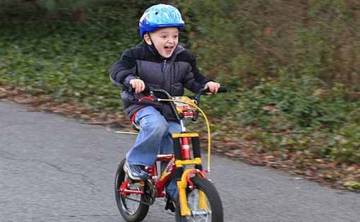 little boy riding a bike