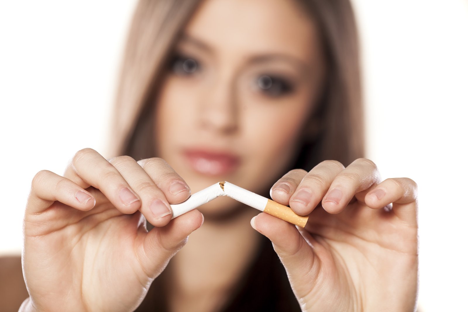 Woman Breaking a Cigarette